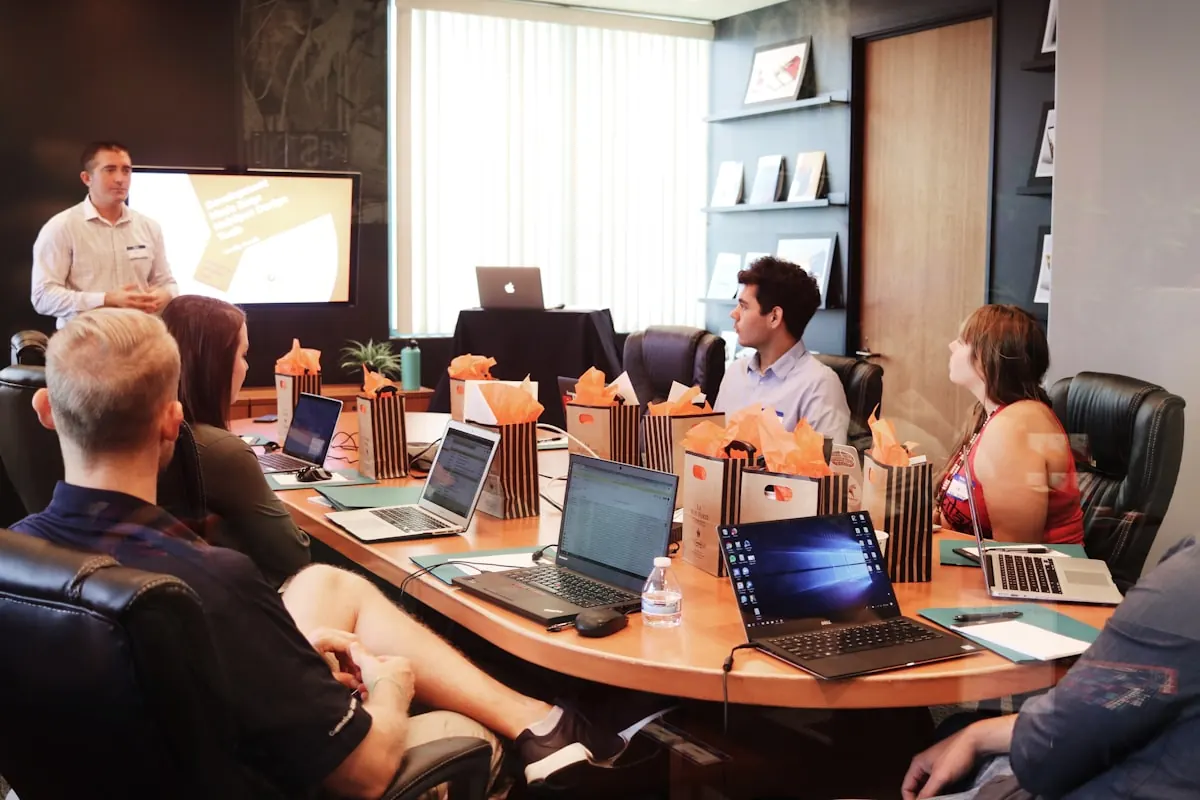 Business users reviewing training notes and user acceptance testing scenarios