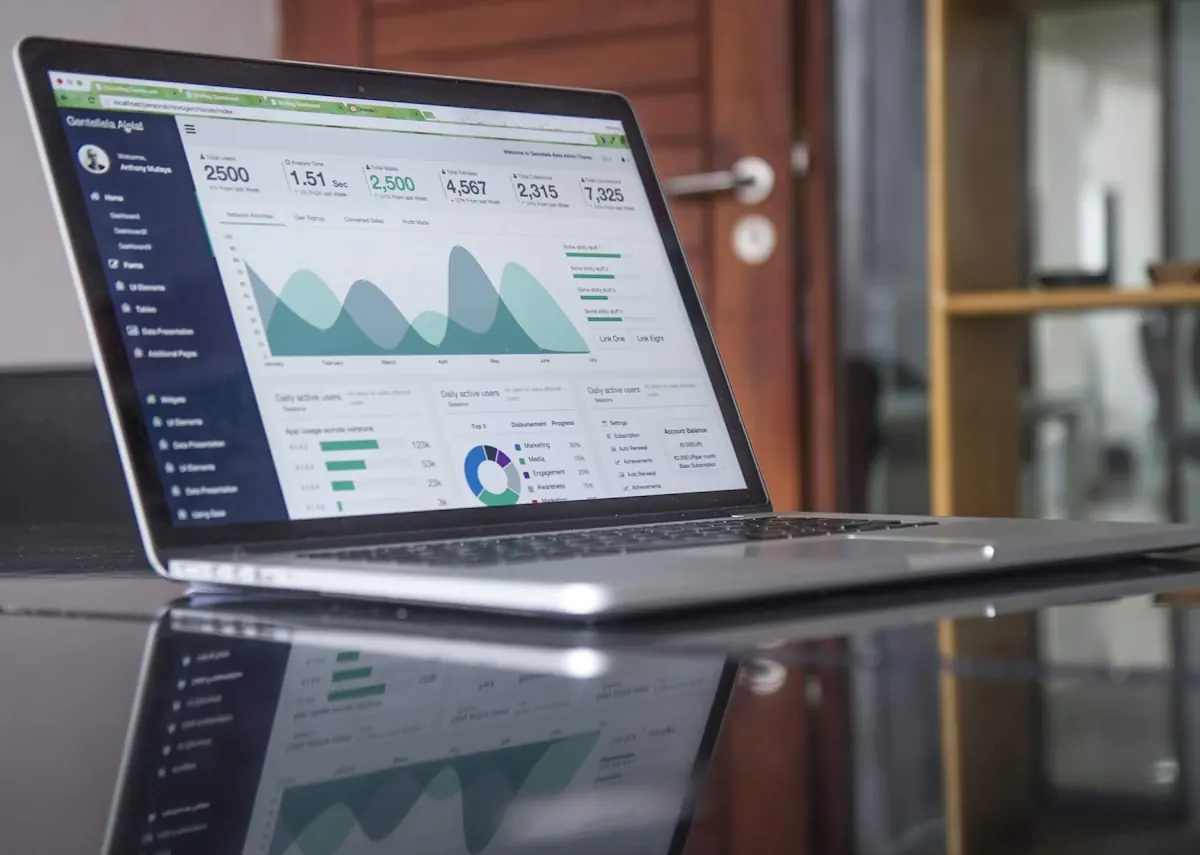 Laptop dashboard showing structured sales, inventory and finance data for systems review